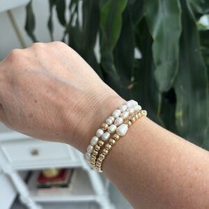 14k gold plated beads over sterling silver and fresh water pearl stimulant.